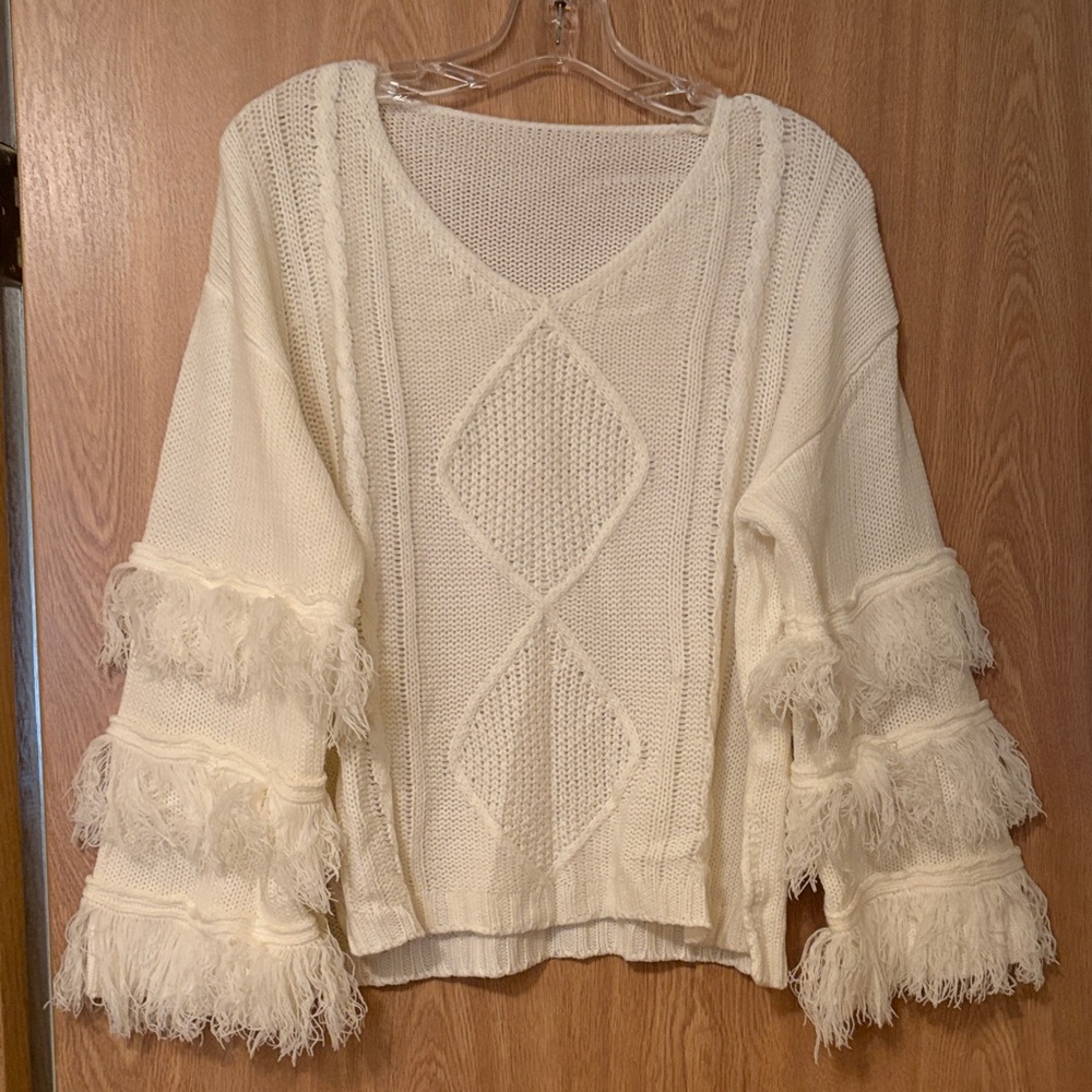 Elegant Cream Sweater with Fringe Details